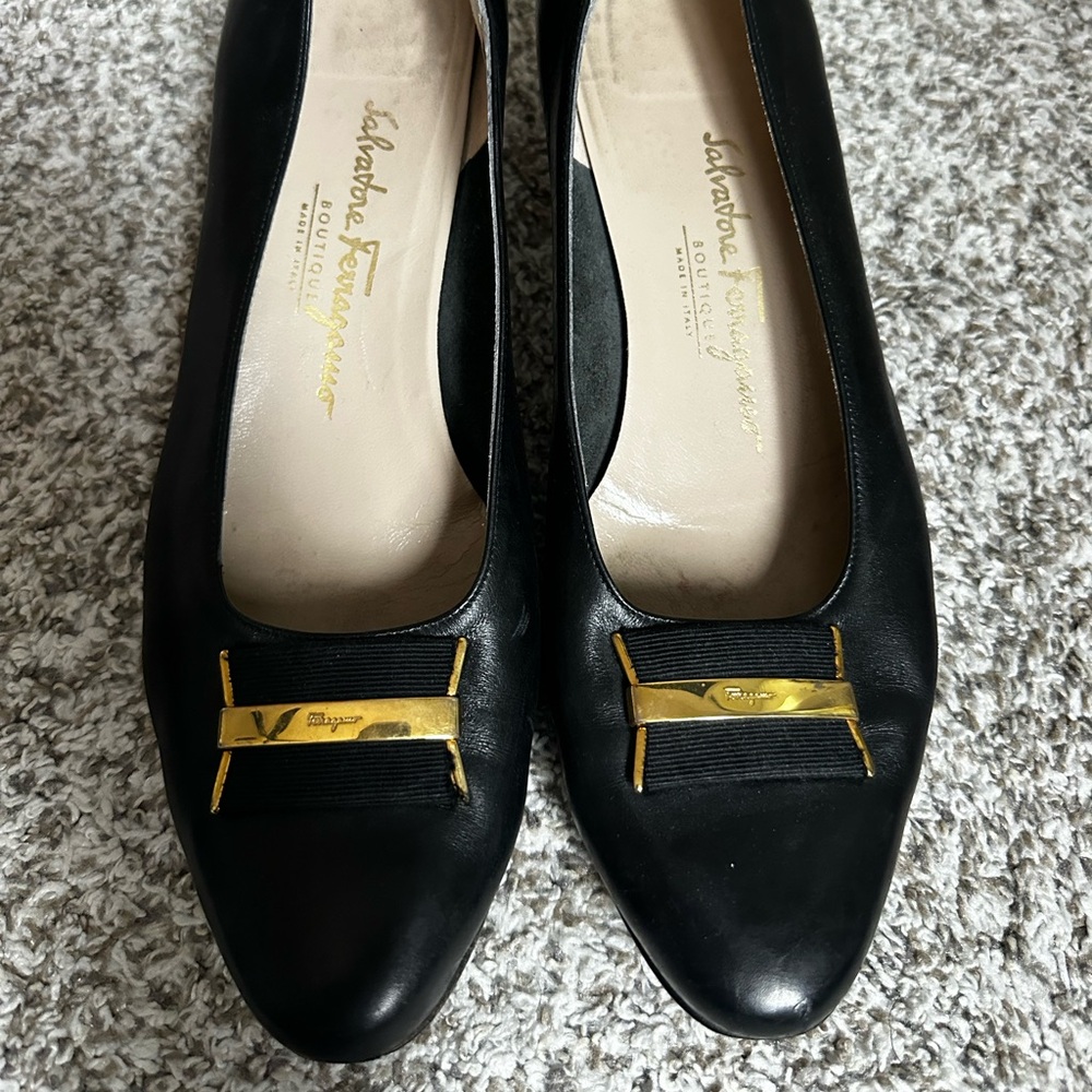 Black Salvatore Ferragamo 10.5 B small scratch on left toes.